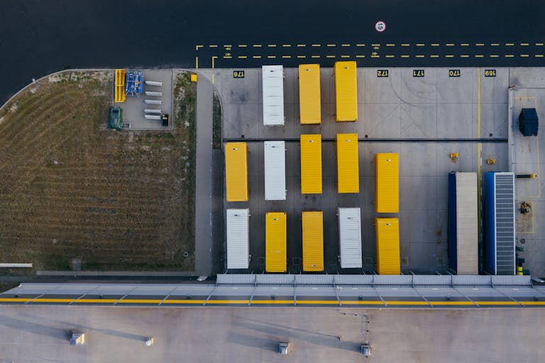 Aerial shot of colorful cargo containers at a warehouse in Poznań, Poland.